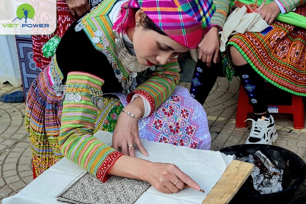 Ưatch Hmong women demonstrate the Beeswax Batik Resist Dyeing Technique