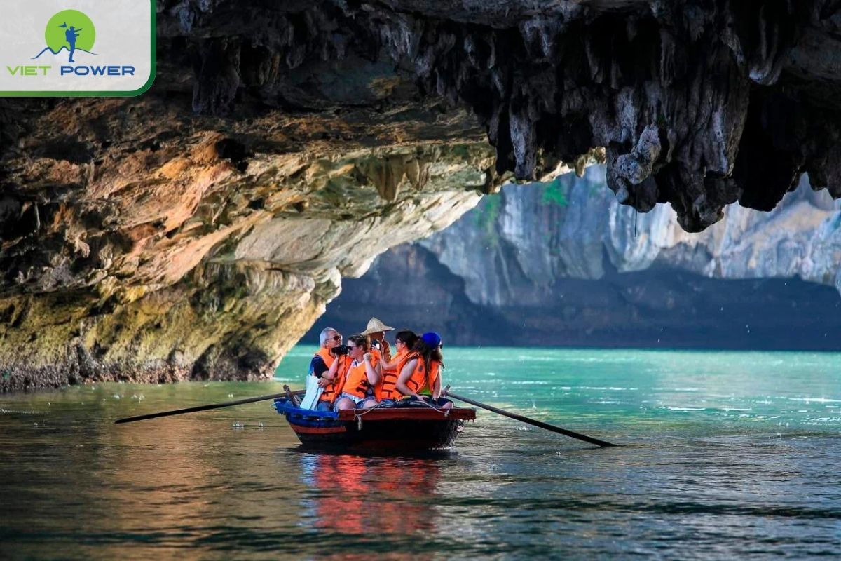 Bamboo boat ride to Dark and Bright Cave
