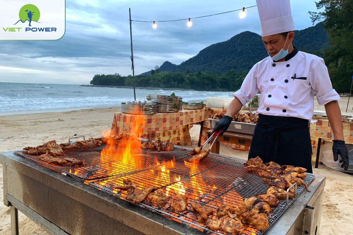 Beachfront BBQ lunch with freshly grilled seafood